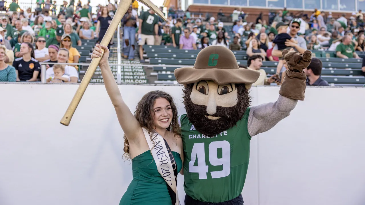 Abby Grace Bare with Norm and the Golden Pickaxe after being named the Golden Niner