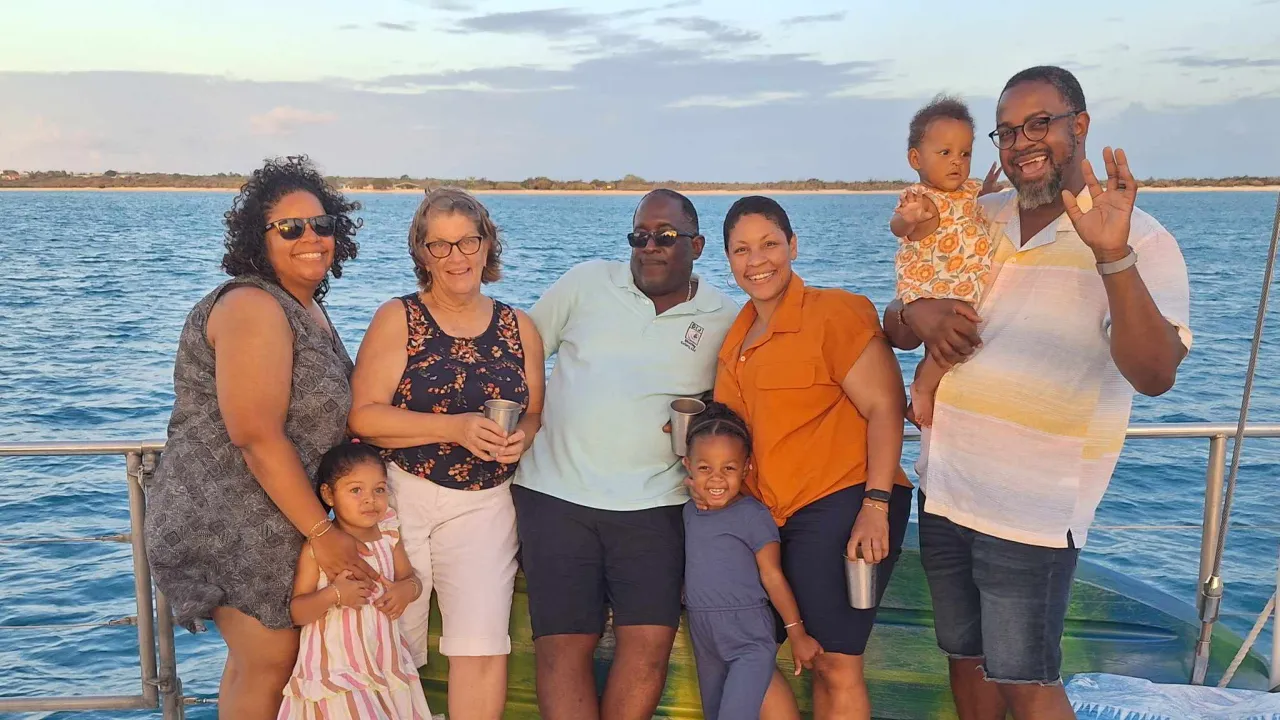 Chris Smith with his family on a boat