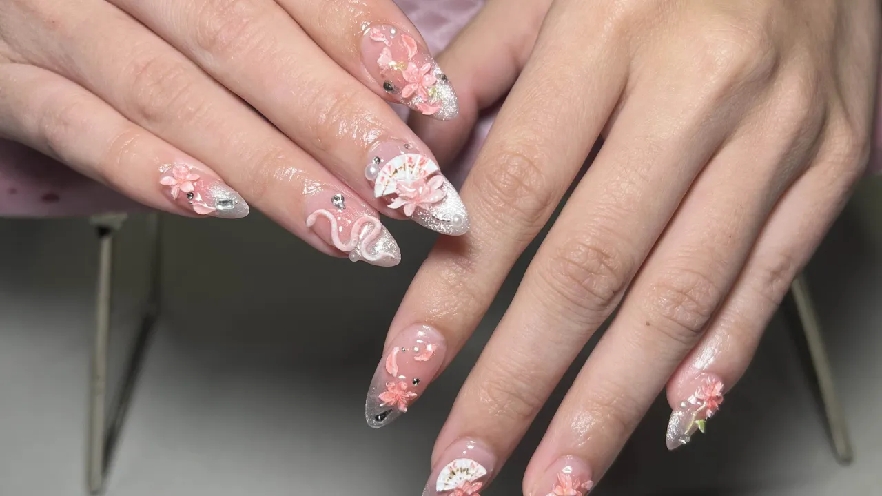 Sophia Park nail designs on hands, light pink colors