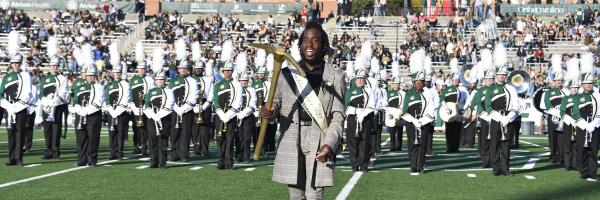 Ra'Quan Leary is named the 2022 Golden Niner on the football field at halftime of the Homecoming game