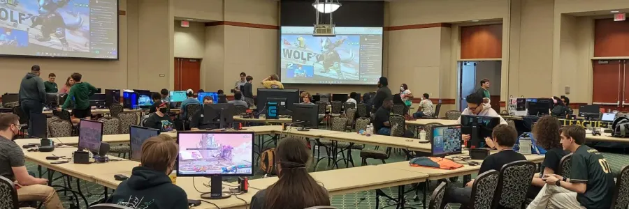 Students sitting in Popp Martin Student Union 340 playing video games.