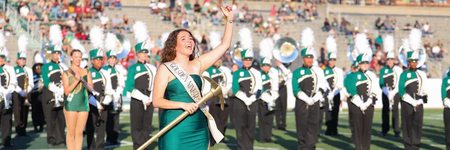2025 Golden Niner on field with marching band