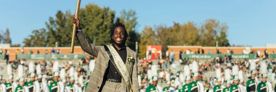 Ra'Quan Leary smiling while holding the golden pickaxe