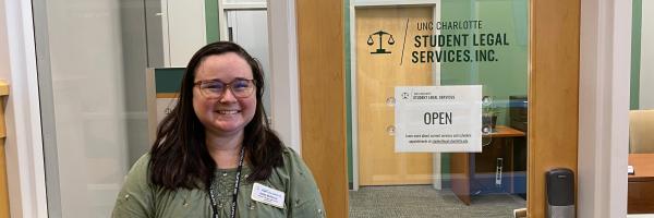 Ashley McAlarney standing in front of the Student Legal Services office in the Popp Martin Student Union.