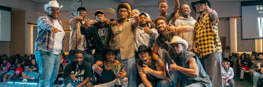 The Mu Tau chapter of Alpha Phi Alpha celebrating its eighth stroll competition victory