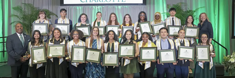 All 20 honorees of the University Honors and Awards ceremony, along with Bailey and Chancellor Gaber