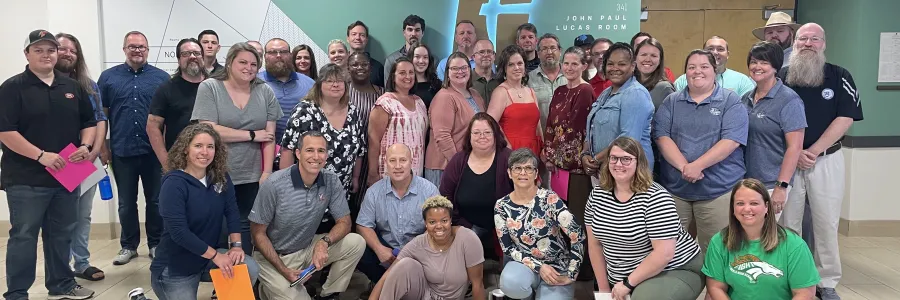 High school teachers smiling for a group photo in Charlotte's Cone Center