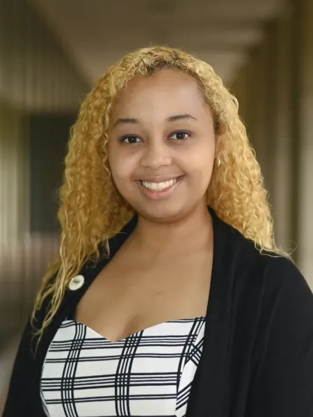 Elizabeth Beattie similing in a hallway