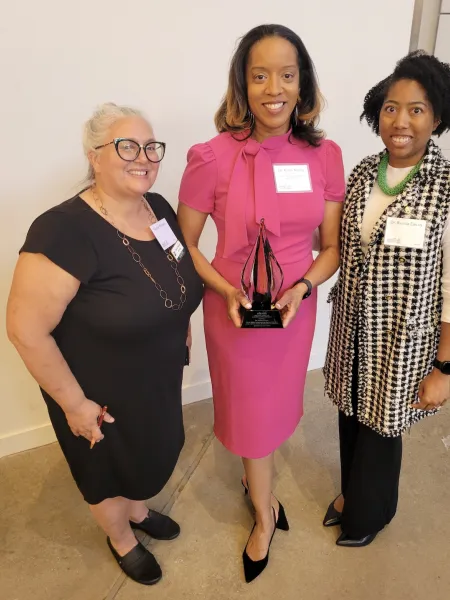 Dr. Kisha Young with her Joyce Award for Excellence in Volunteerism