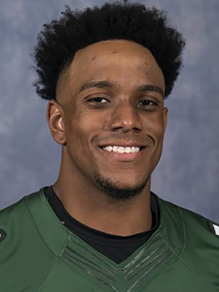 Matthew Longley smiling wearing a Charlotte 49ers football jersey.