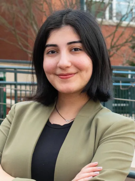 Sunnya Hadavi crossing her arms in a blazer 