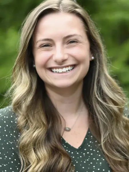 Emmy Womble smiling outside