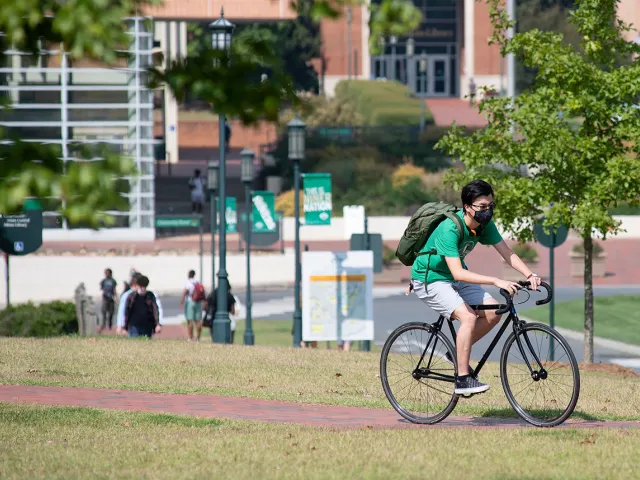 Student riding a bike