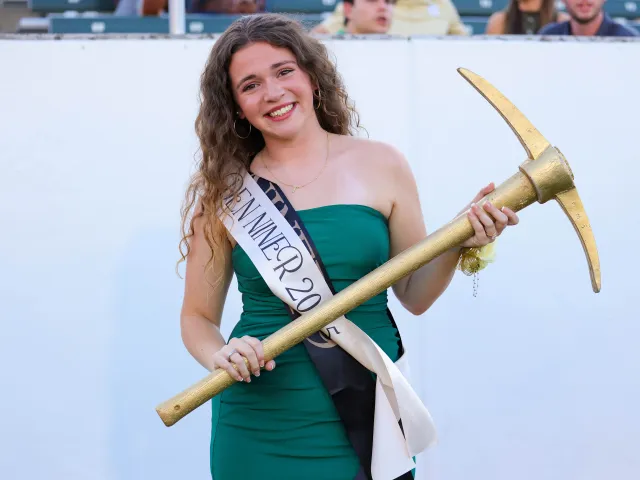 Abby Grace Bare smiling with the Golden Pickaxe