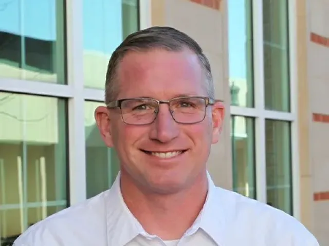 Donny Edwards smiling outside of the HRL building