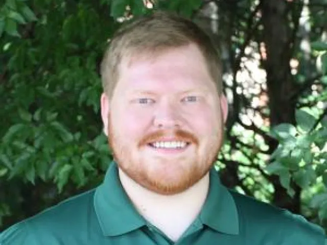 Headshot of Donovan Cyrus smiling