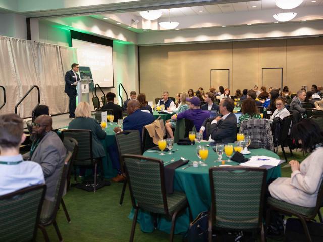Dr. Brad Yeckley speaking at the second annual UNC Financial Literacy Symposium