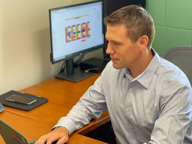 Brad Yeckley sitting at his computer