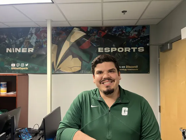 Ian Escalante in the temporary Niner Esports space in the Popp Martin Student Union