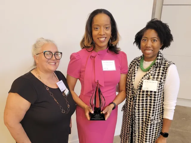 Dr. Kisha Young with her Joyce Award for Excellence in Volunteerism