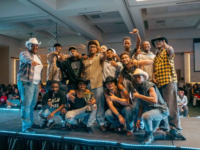 The Mu Tau chapter of Alpha Phi Alpha celebrating its eighth stroll competition victory