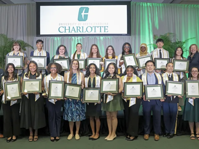 All 20 honorees of the University Honors and Awards ceremony, along with Bailey and Chancellor Gaber