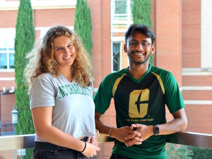 Two UNC Charlotte students smiling at the camera