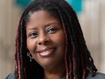 Headshot of Dr. Re'Shanda Grace-Bridges smiling