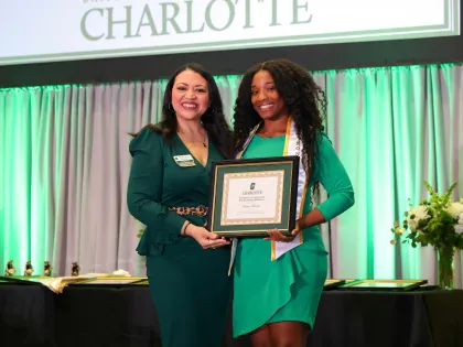 A student receiving an award at the University Honors and Awards