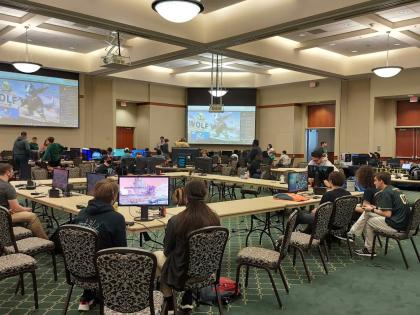 Students sitting in Popp Martin Student Union 340 playing video games.