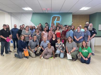 High school teachers smiling for a group photo in Charlotte's Cone Center