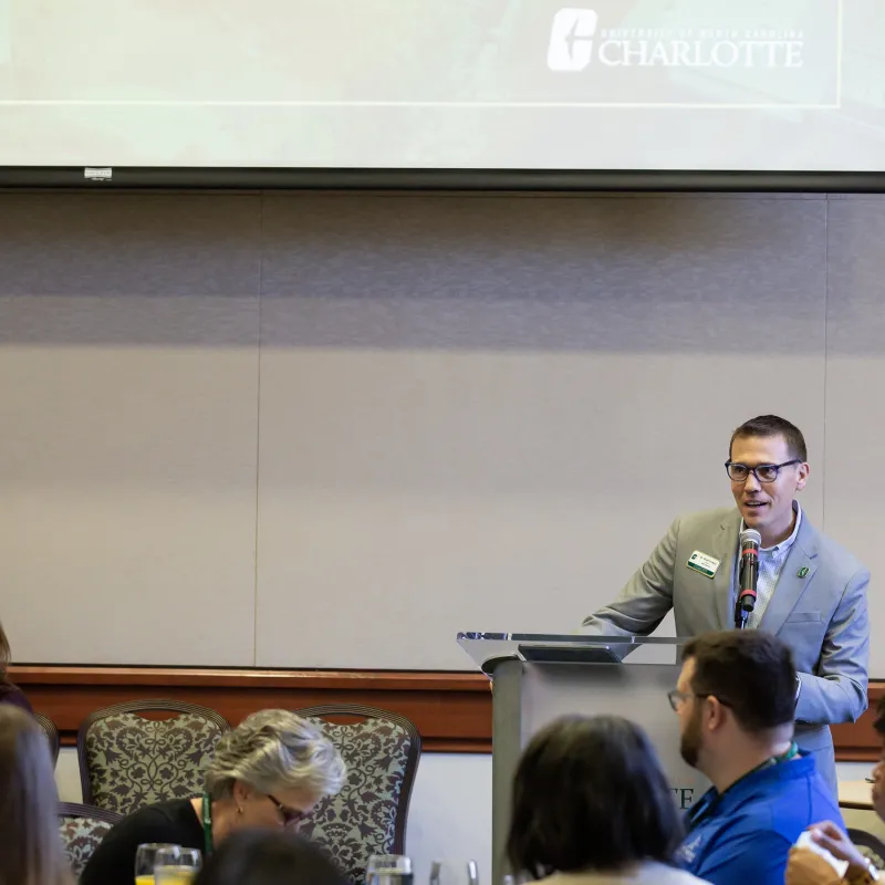 Dr. Brad Yeckley, director of Niner Finances, speaking at the Financial Literacy Symposium