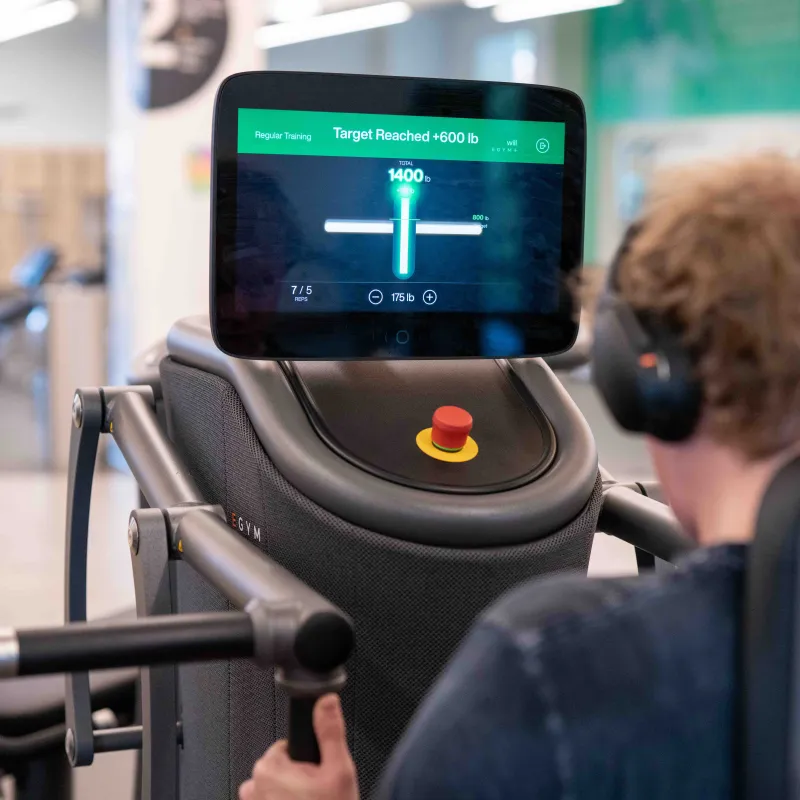 A student using the new EGYM equipment with his digital screen displayed