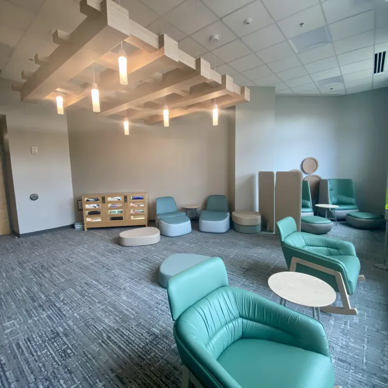 View of the Niner Nest's seating, lockers of items and warm lighting