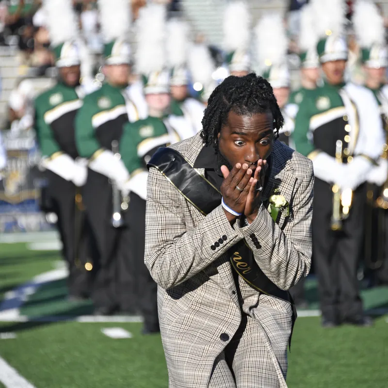 Ra'Quan Leary with his hands over his mouth in shock after being announced as the Golden Niner