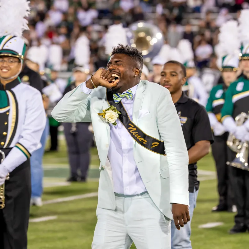 S.L. Ivey with his eyes closed smiling after winning the Golden Niner